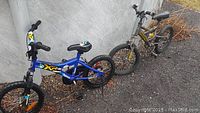 Blue XR 16 kids bike with front suspension and black tires, padded seat with graphic, and black handlebars with grips.