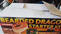 Box with 'Bearded Dragon Starter Kit Juvenile' branding and picture of a bearded dragon