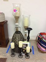 Wide shot of all candle holders and candles showing variety and arrangement