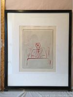 Frontal view of framed lithograph with measurement scale