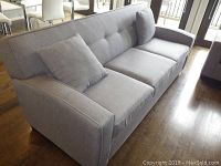 Front-left three-quarter view showing overall design, color and cushion layout