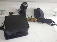 Photo showing Kadori 2300 hair dryer, BaBylissPRO electric hair brush with gold bristle barrel, black carrying case for Conair electric hair cutter.