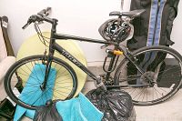 Side view of Trek hybrid bicycle with U-lock and helmet attached