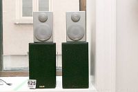 Both pairs of speakers displayed: two KLH Radius 90 on the bottom with fabric covers and two silver Contempo 3 Satellite speakers on top.