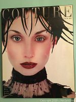 Close-up of August 1955 Couture magazine cover with woman in dark hair and blue eyes