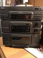 Photo of RCA three-unit 3-disc audio system stacked vertically, showing disc changer, tuner, and tape deck