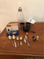 Overall lot view showing all pieces on wooden surface