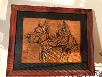 Framed copper etching showing the detailed dog portrait