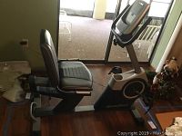 Full side view of the NordicTrack recumbent exercise bike showing the seat, pedals, and frame.