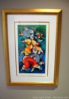 Full view of the framed print showing the artwork and gold frame.