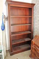 Full front view of bookcase showing overall structure and finish.