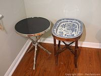 Both tables side by side in corner on hardwood floor