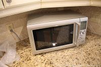 Front and side view of Breville microwave on kitchen countertop