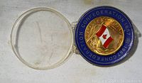 Front side of the medallion showing Canadian flag with blue enamel surrounding text about Confederation 1867 to 1967