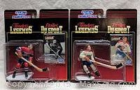 Photo of two unopened Starting Lineup Timeless Legends hockey player action figures and cards, Maurice Richard and Jean Beliveau, in blister packaging.