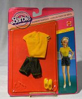 Full front view of one unopened Barbie Fashion Fantasy outfit for Christie featuring yellow top, denim shorts, and yellow shoes in original packaging.