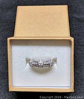 Judith Ripka sterling silver size 10 ring displayed in beige box with white interior.