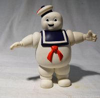 Single Stay Puft marshmallow man figure with arms outstretched, showing detail of face, sailor collar and hat