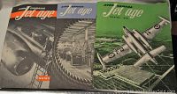 Three Jet Age magazine covers from Avro Canada laid side by side showing aircraft themed cover art from 1952.