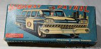 Original lithographed box showing “Highway Patrol” graphics, Cragston logo and “Friction Motor Powered” text