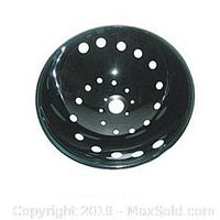 Close-up of black round ceramic sink showing multiple holes for faucets and drains.