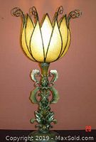 Full view of one table lamp showing detailed floral yellow glass shade and ornate base