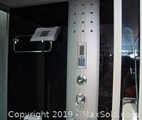 Upper interior control panel, soap tray and chrome trim of steam shower cabin