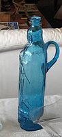 Blue Madonna style blue glass vase with handle and detailing