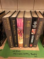 Photo of six hardback fantasy fiction books by Mercedes Lackey with visible titles and author names on spines.