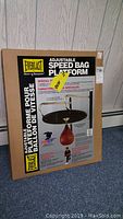 Front view of the unopened Everlast speed bag platform in its original box, showing product details and branding.