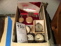 Box containing two gold-tone Gruen hunter-case watches, one chain, one silver square watch and five open-face silver watches