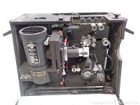 Front and top side view of the antique 16mm Victor cine projector showing its mechanical parts and reels.
