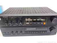 Top view of Kenwood KA-52B amplifier stacked on TEAC AG-250 receiver, showing front panels with controls and meters.