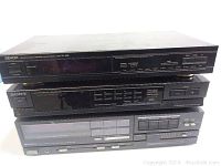 Stacked view of Denon TU-280 tuner on top, Sony ST-JX380 tuner middle, Hitachi HTA-25F amplifier bottom with front panel details.