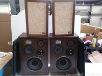 Lot of four vintage Pro Linear speakers with wooden cabinets, front fabric grilles, and three driver units each.