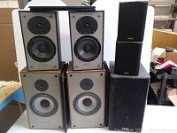 All items together: two bookshelf pairs, satellite pair and subwoofer