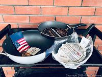 Photo showing the set of three pans - Nordic Ware wok and two Lagostina frying pans, all new with tags and receipt.