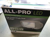 Box showing All Pro LED single head floodlight branding and specs with model number FSL2850LW. 3100 lumens, 280W equivalent, 5000K.