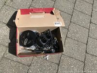 Box containing walkie talkies, portable CD player, and accessories