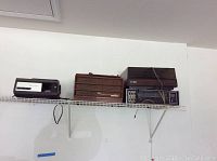 Wide shot showing the stereo equipment on a shelf: GE tuner, BSR McDonald turntable, RCA Victor receiver, and Argus slide projector.