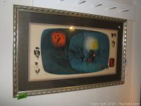 Full view of framed print against white wall