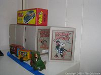 Overview of lot: zig-zag train set, Riot Car box, two Disney display boxes
