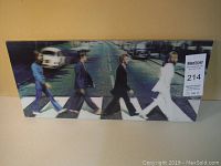 Front view of The Beatles Abbey Road 3D vinyl and wood plaque showing the band members crossing the street on a crosswalk with 3D effect.
