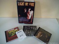 Photo of the book and three CDs with their cover art visible