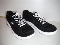 Side and front angled view of black Dr. Scholls running shoes with white soles and laces.