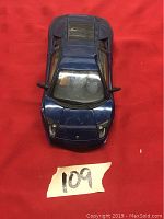 Top view of blue 1:18 Hot Wheels Lamborghini die cast model car showing hood closed and minor wear.