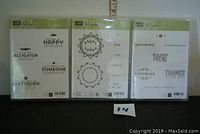 Front view of three Stampin' Up! stamp sets packaging showing sample stamp images and logos