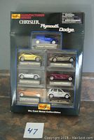 Full view of unopened Maisto Chrysler, Plymouth, Dodge die cast car set packaging showing all seven cars in blister pack.