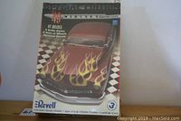 Box front showing 1949 Mercury Custom Coupe with flames art and Revell logo