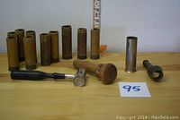 Full kit arranged in one photo showing all items: paper shells, tamper, crimper, measuring tool.